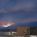 Outdoor Leisure Chair with Metal Frame and Canvas Seat Enjoying Sunset Over Mountain and Lake View