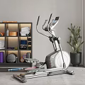 Modern Indoor Fitness Equipment With Elliptical Trainer Storage Shelf Towels Dumbbells And Yoga Ball