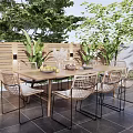 Outdoor Wooden Table With Rattan Chairs Set And Green Plants On Tiled Floor