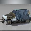 Old Abandoned Car With Damaged Body Covered In Blue And Brown Tarp On Gray Ground
