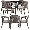 Modern Round Wooden Table With Four Woven Back Chairs And Gray Cushions Metal Legs