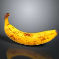 Ripe Yellow Banana With Brown Spots On Black Surface Showing Clear Reflection