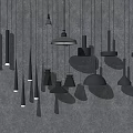 Black Pendant Lights With Various Designs Hanging From Gray Ceiling In Different Shapes And Sizes