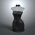 Black Strapless Evening Dress On Transparent Mannequin With Bow And Ruffled Hem