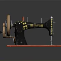 Vintage Sewing Machine With Gold Star Decorations On Red Base And Wheel