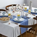 Elegant Dining Table Set With Wooden Chairs White Flowers Blue Runner And Homemade Pie