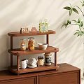 Three Tier Wooden Storage Shelf With Cups Plates Jars And Decorative Items
