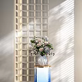 White Vase With Mixed Flowers On Pedestal Against Geometric Pattern Wall With Sunlight Shadows
