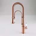 Stylish Copper Kitchen Faucet With Curved Spout And White Handle Design