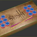 Assorted Sushi Rolls On Wooden Tray With Chopsticks And Engraved Sushi