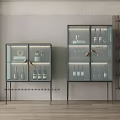 Two Modern Wine Cabinets With Glass Doors Wine Bottles Glasses And Interior Lighting