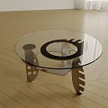 Modern Coffee Table With Clear Glass Top And Metal Base Featuring Decorative Holes