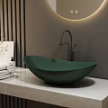 Green Bowl Vessel Sink With Black Faucet On White Marble Countertop And Striped Wall