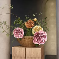 Wicker Basket Holding Pink Yellow Orange Flowers Green Leaves On Wooden Blocks Gray Wall Arch