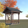 Traditional Chinese Pavilion With Black Tiled Roof And Colorful Trees In Grassland