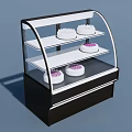 Three Tiered Black White Kitchen Appliance Display Case With Curved Glass And White Cakes