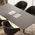 Black Conference Table with Black Chairs and Two White Papers on Top