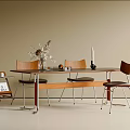 Modern Dining Table And Chairs Set With Wooden Backrest Metal Legs And Dried Flower Arrangement