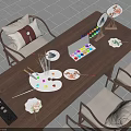 Daily Life Essentials On Wooden Table Featuring Palette Paintbrushes Fan Art And Laptop