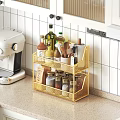 Golden Kitchen Two Tier Wire Shelf With Spices Olive Oil And Wooden Spoons On Countertop