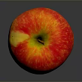 Fresh Vibrant Red Apple With Yellow Speckles On Dark Background