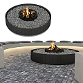 Outdoor Circular Fire Pit With Black Frame And Gray Pebbles For Garden Decor