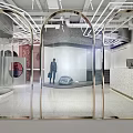 Modern Clothing Store Interior With Arched Mirrored Doorways And Stylish Display Lighting