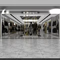 Modern Clothing Store Interior With Stylish Display Racks And Shelves And Green Plants And Lighting