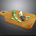 Wooden Cutting Board With Whole Cucumber Knife And Sliced Cucumber