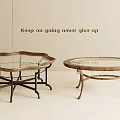 Two Stylish Coffee Tables With Glass Tops And Decorative Metal Leg Designs