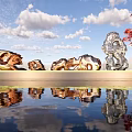 Golden and Silver Metal Sculptures By Water Reflection With Red Leaf Tree Under Blue Sky
