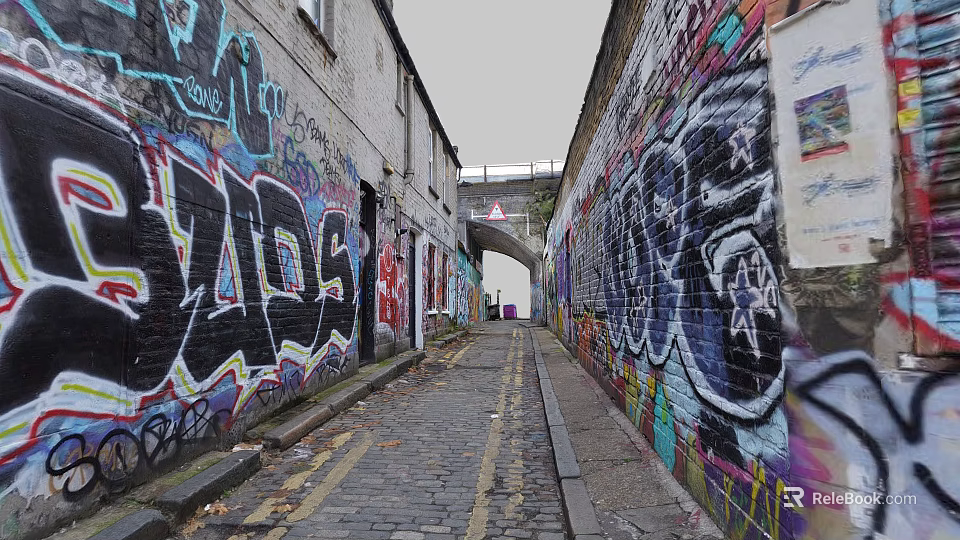 Vibrant Commercial Street Featuring Graffiti Covered Buildings Cobblestone Path and Distant Archway 3d model 