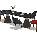 Modern Black Dining Table Set With Multicolor Chairs Green Plant Vase And Metal Base