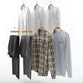 Men's Clothing Including Gray Pants Plaid And Striped Shirts On Wooden Hangers