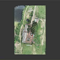 Aerial View of Ancient Architecture with Red Roof Surrounded by Green Grass and Trees