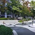 Modern Garden Landscape with Lush Trees Playground Pathway and Seating Benches