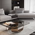 Elegant Modern Coffee Table With Glass Top Bronze Frame And Open Magazines In Living Room
