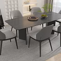 Contemporary Dining Table Set With Black Marble Top Six Gray Fabric Chairs And Green Plant
