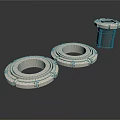 Industrial Metal Ring Components Two Flat Placed And One Upright With Black Base