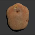 Single Fresh Organic Red Potato With Natural Skin Texture On Dark Background Surface