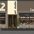 Modern Coffee Shop Art Studio Storefront With White Signage Brown Grille And Outdoor Seating