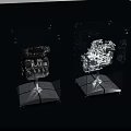 Detailed Engines Exhibited in Transparent Display Cases with Silver Stands