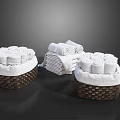 Neatly Rolled And Folded White Towels In Wicker Baskets For Bathroom Decor Essentials