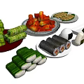 Assorted Traditional Asian Food Including Rice Dumplings Seaweed Rolls And Steamed Pastries