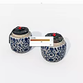 Traditional Ceramic Jars With Blue And White Floral Patterns And Red Top Accents