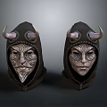 Two Horned Leather Masks With Intricate Metal Carvings And Hooded Design