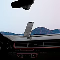 Car Phone Mount For Smartphone On Dashboard In Car Interior With Mountain View