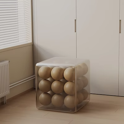 Transparent Cube Side Table With Wooden Balls In Room With White Cabinets And Window 3d model