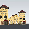 Mediterranean Style Entrance Gate With Yellow Exterior Towers Red Roofs And Arched Doorways