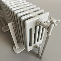 White Column Radiator With Metal Valves And Base For Home Heating Interior